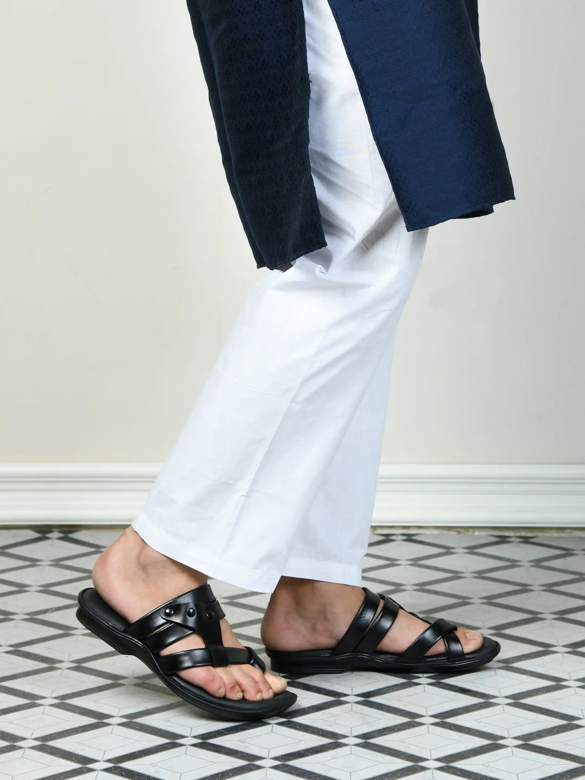 man wearing black slipper